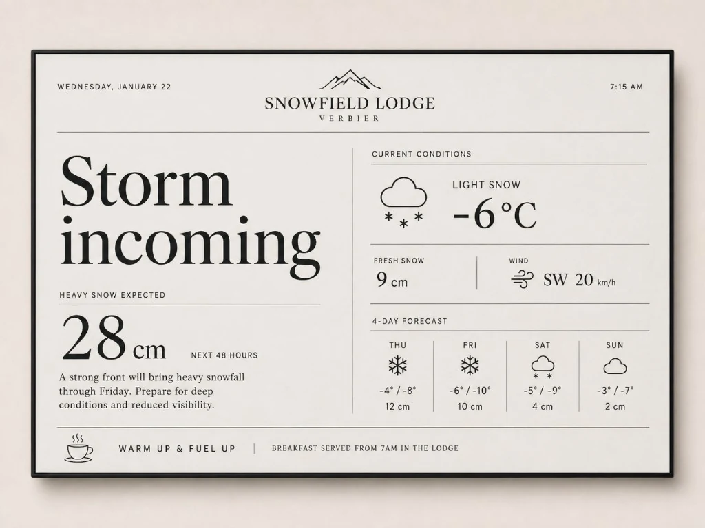 Snowfield Lodge Verbier cream board announcing incoming snow